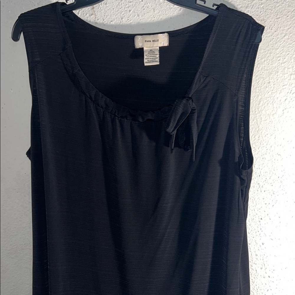 Chic Black Sleeveless Blouse with Bow Detail 

FYI: Video Available